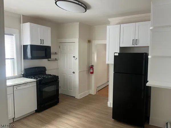 a kitchen with a refrigerator stove and a sink