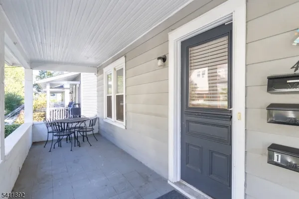 a dining room with furniture and windows