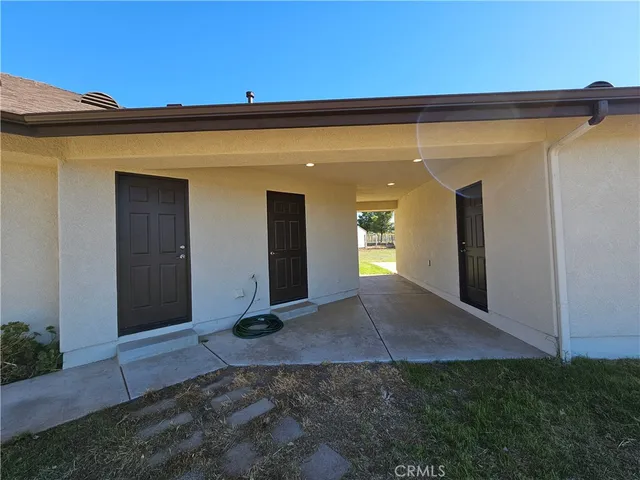 a view of a livingroom with a fireplace and a window