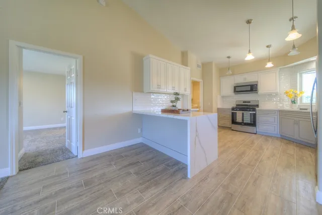 a bathroom with a granite countertop sink mirror and double