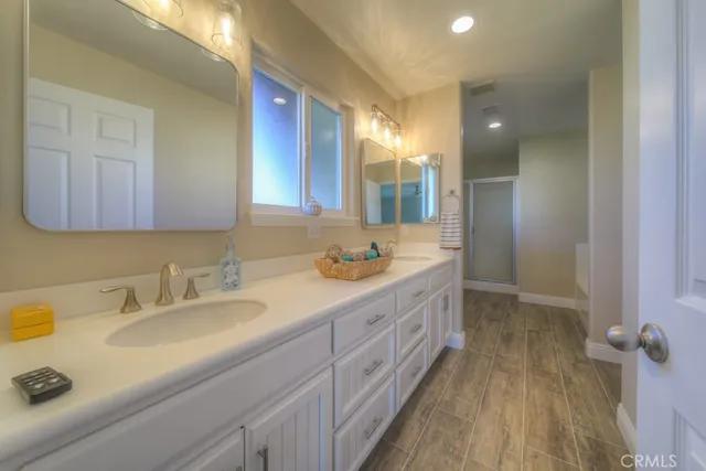 a view of hallway with wooden floor