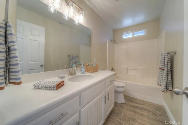 a view of a patio with a table and chairs