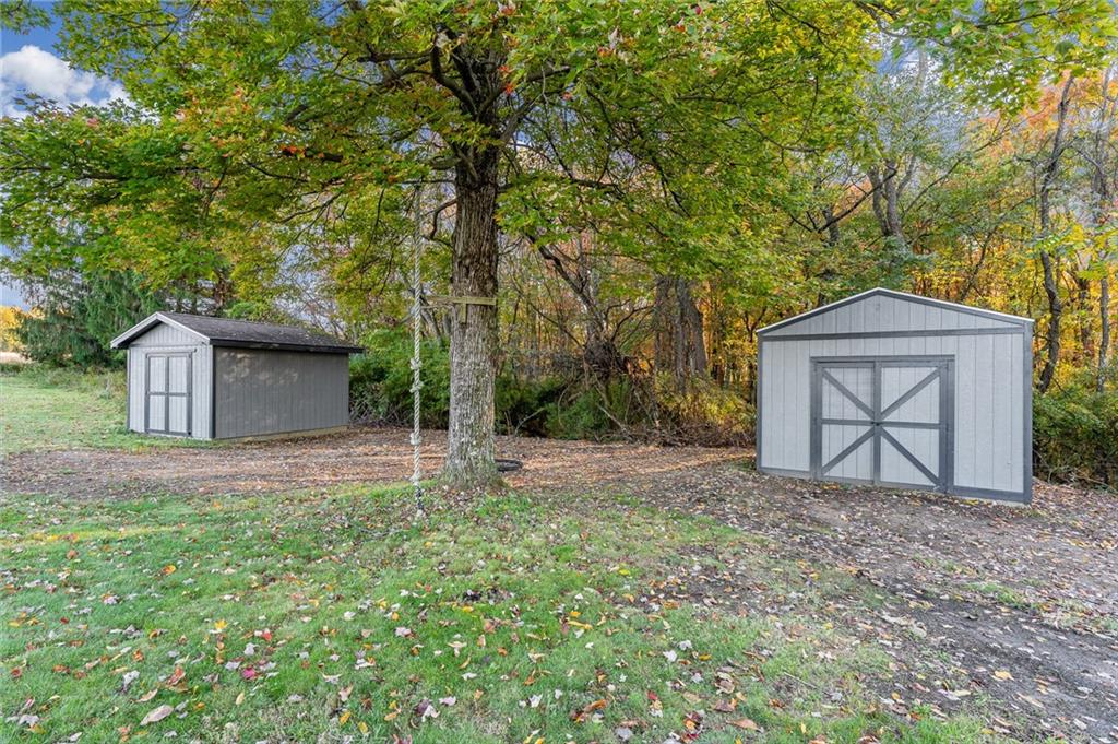 263 Goodwin Road Smithfield, PA 15478 - Photo 9 of 50 a backyard of a house with large trees and wooden fence
