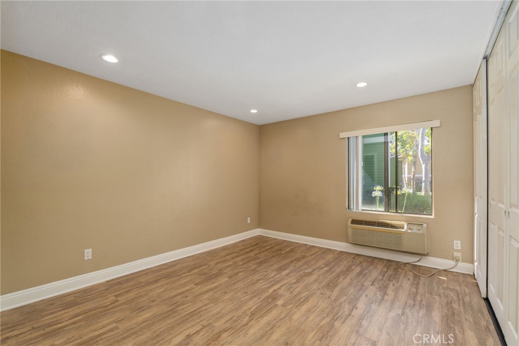 3535 Banbury Drive, Unit 119 Riverside, CA 92505 - Photo 11 of 23 a view of empty room with wooden floor and fan