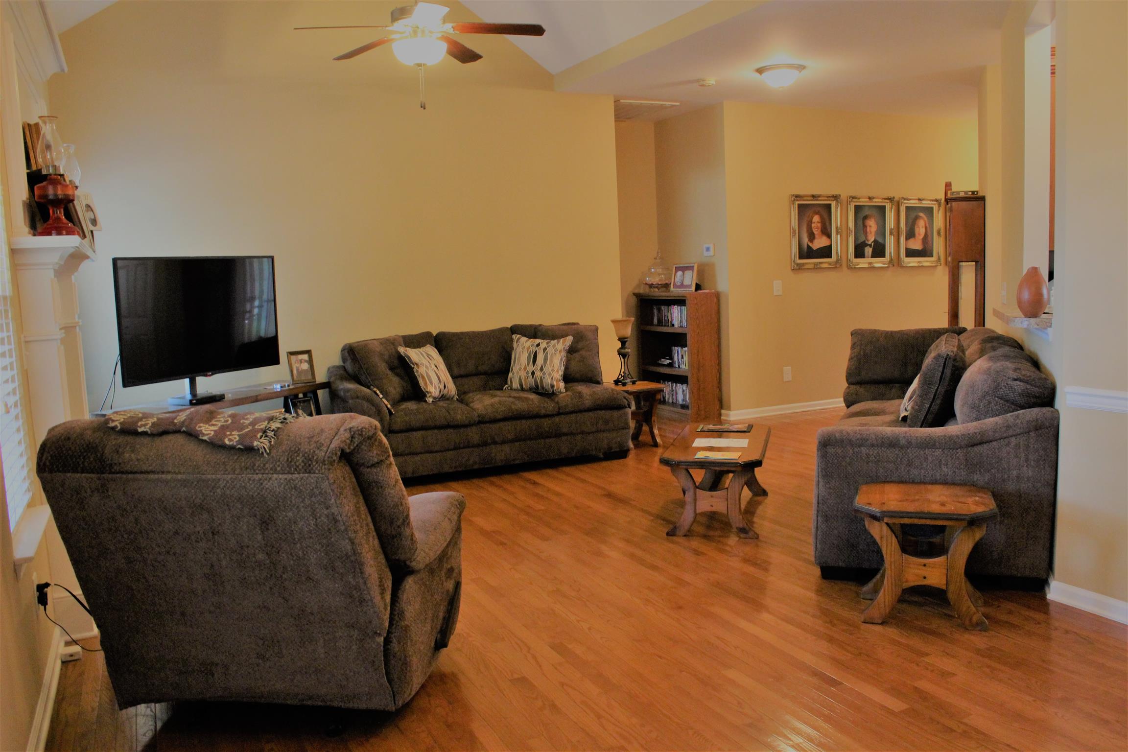 1042 Golf View Way Spring Hill, TN 37174 - Photo 8 of 22 a living room with furniture and a flat screen tv