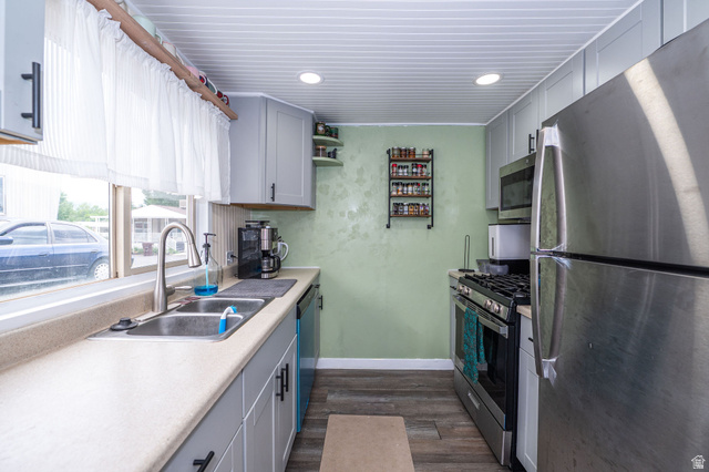 2600 North Hill Field Road, Unit 5 Layton, UT 84041 - Photo 11 of 33 Kitchen featuring light gray cabinetry, stainless steel appliances, light-toned countertops, wood-finish flooring, and recessed lighting