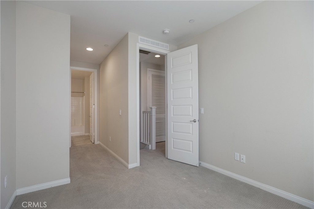 116 Neptune Irvine, CA 92618 - Photo 16 of 25 an empty room with closet and a bathroom