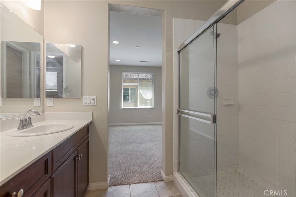 116 Neptune Irvine, CA 92618 - Photo 21 of 25 a bathroom with a sink and a mirror