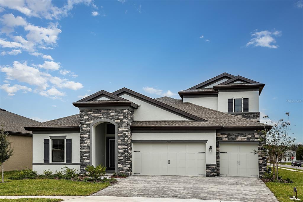 35534 Big Hawk Drive Zephyrhills, FL 33541 - Photo 1 of 1 a front view of a house with garden