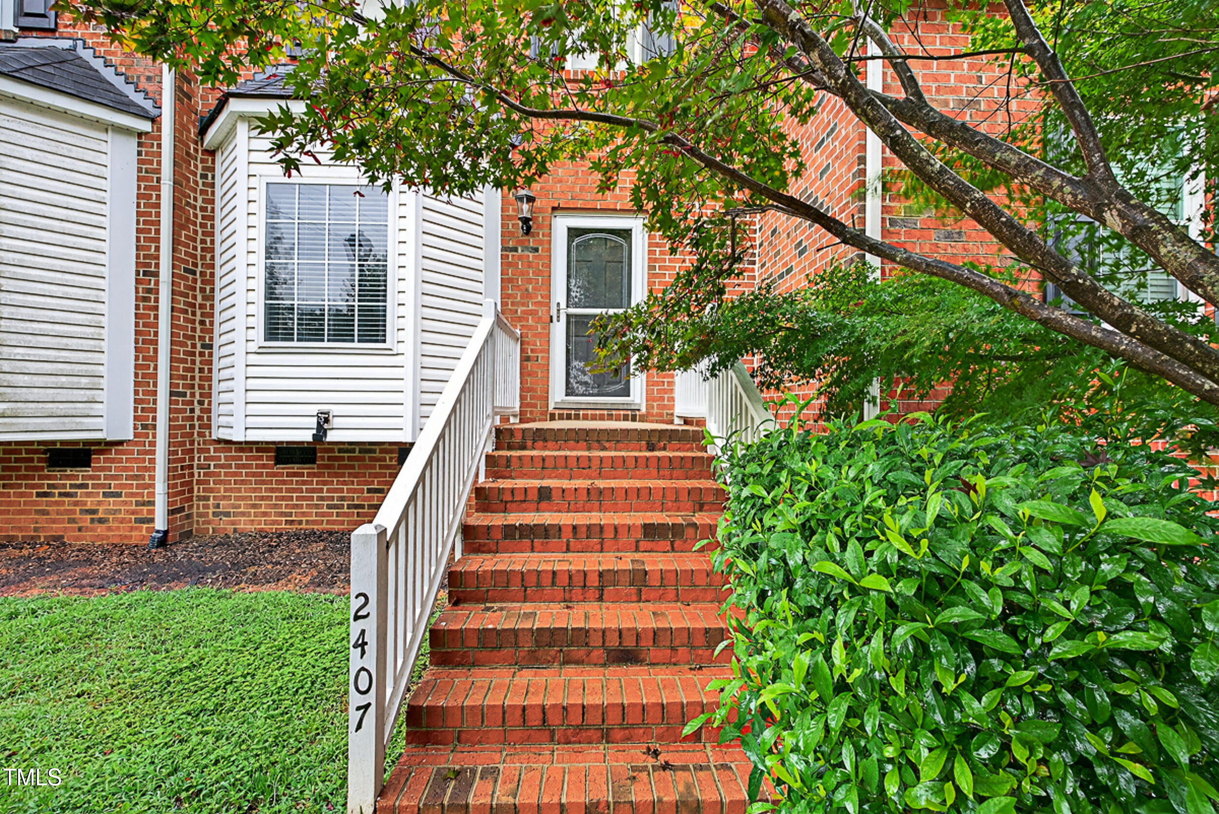 2407 Trout Stream Drive Raleigh, NC 27604 - Photo 2 of 24 a front view of a house with a yard