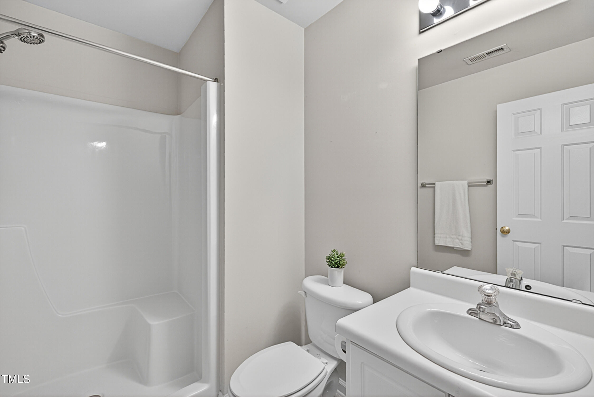 2407 Trout Stream Drive Raleigh, NC 27604 - Photo 21 of 24 a bathroom with a sink toilet and shower