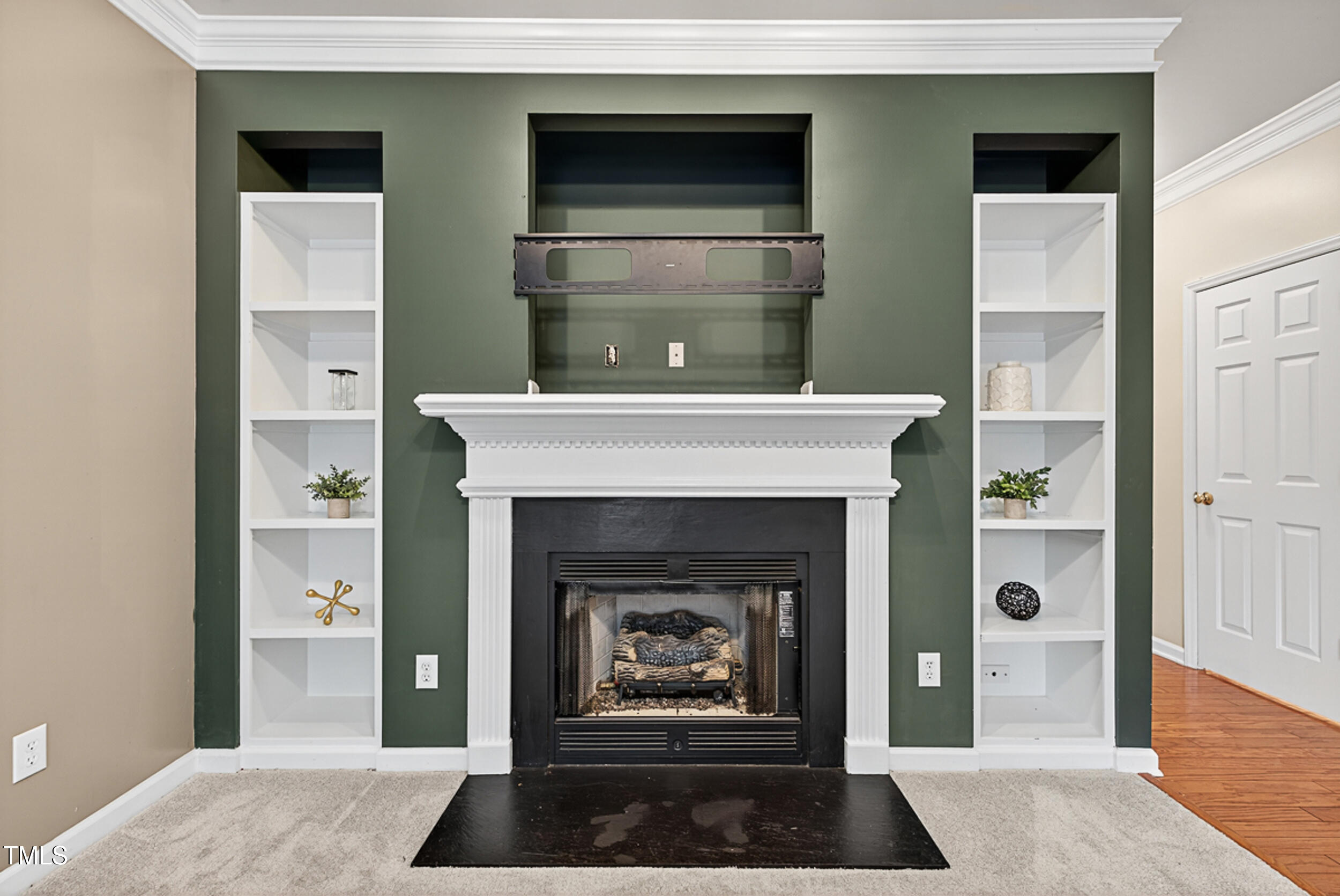 2407 Trout Stream Drive Raleigh, NC 27604 - Photo 5 of 24 a living room with furniture and a fireplace