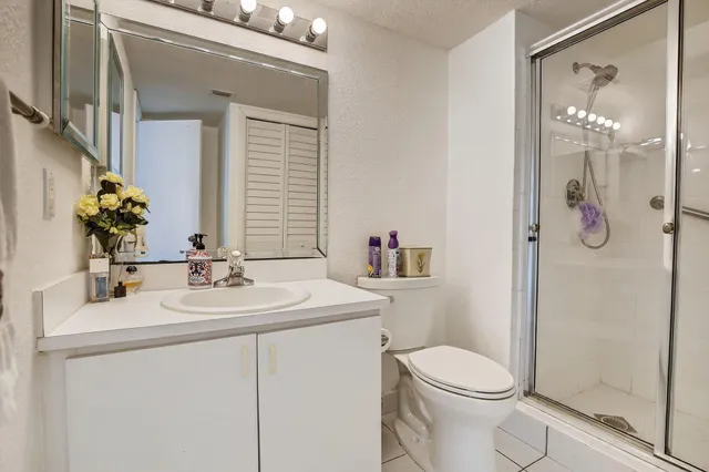 a view of a hallway with dining area and glass doors
