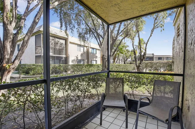 a view of a large mirror with a tree