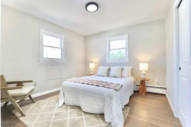 a bedroom with a bed and a chair