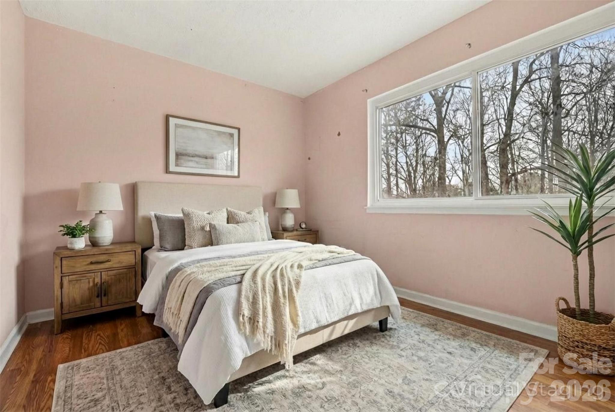 8011 Beacon Hills Road Indian Trail, NC 28079 - Photo 21 of 31 a bedroom with a large bed and a window