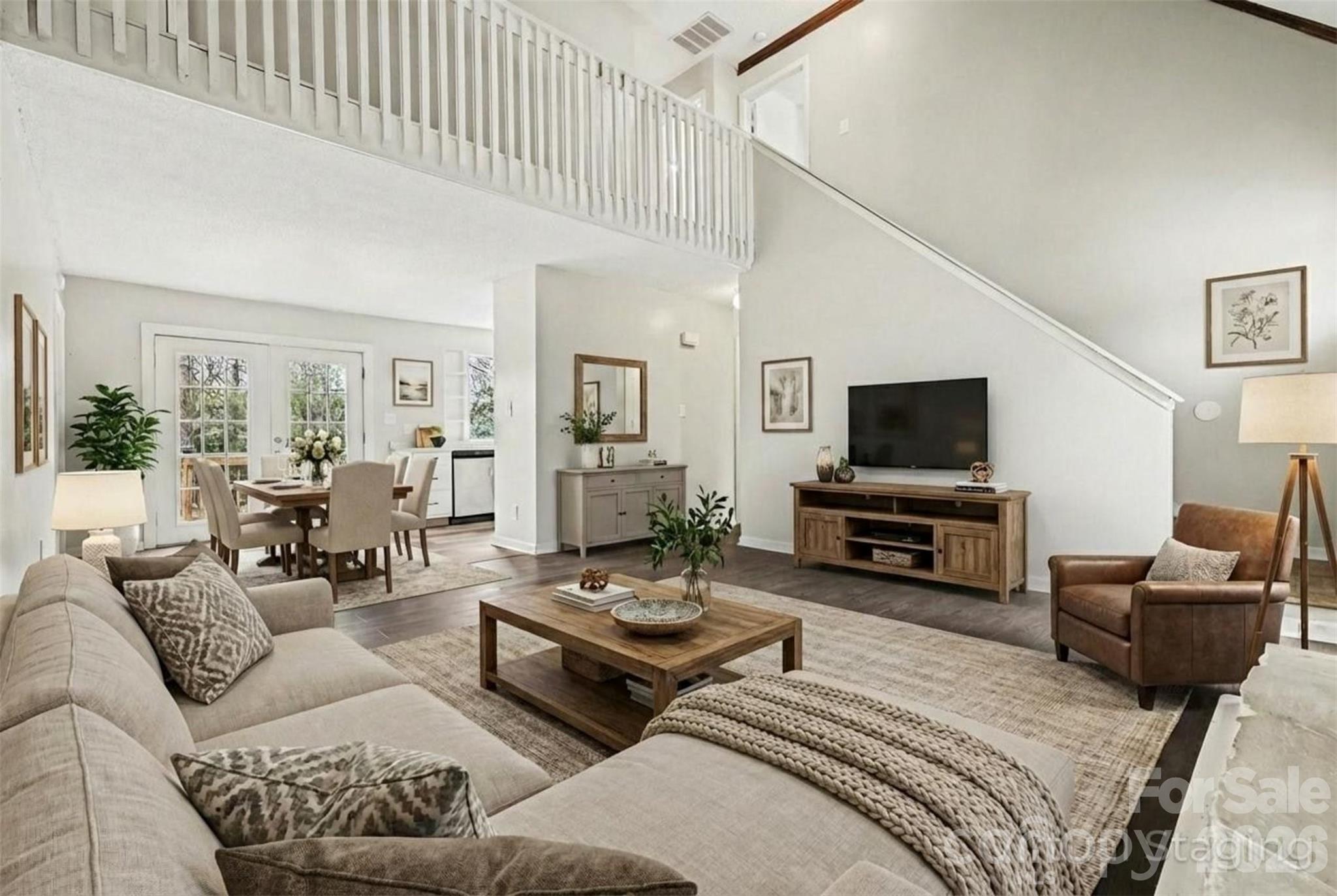 8011 Beacon Hills Road Indian Trail, NC 28079 - Photo 6 of 31 a living room with furniture and a flat screen tv