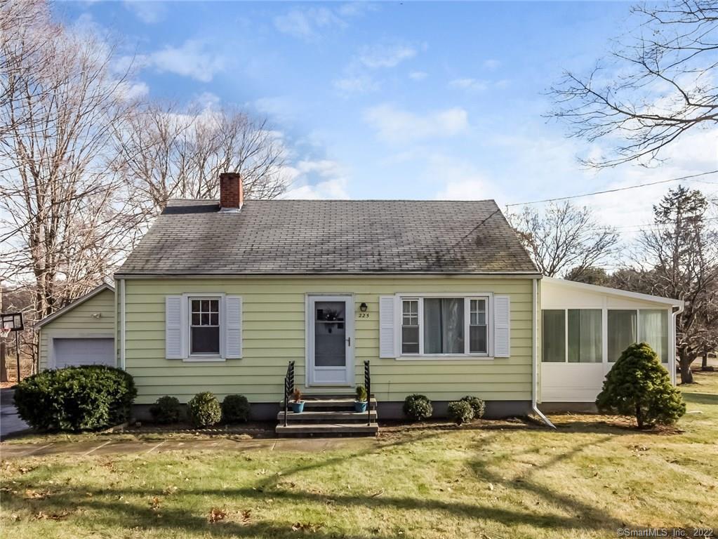 a view of a house with a yard in the back
