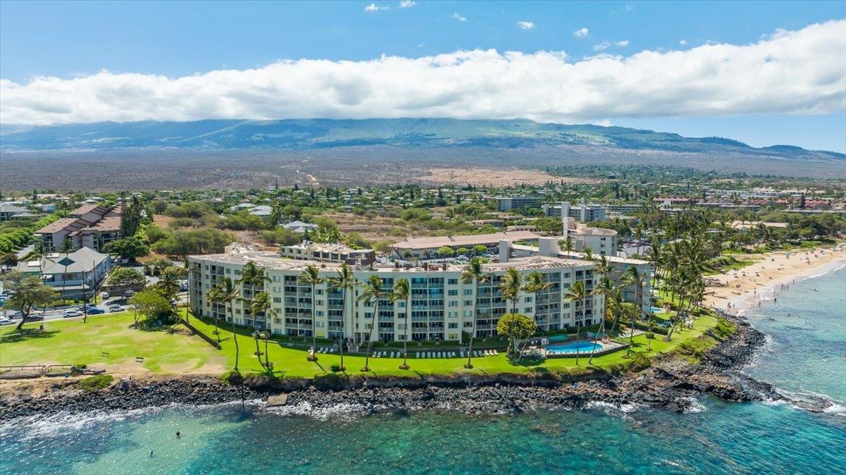 2430 South Kihei Road, Unit 206 Kihei, HI 96753 - Photo 1 of 40 a view of a city with mountains in the background