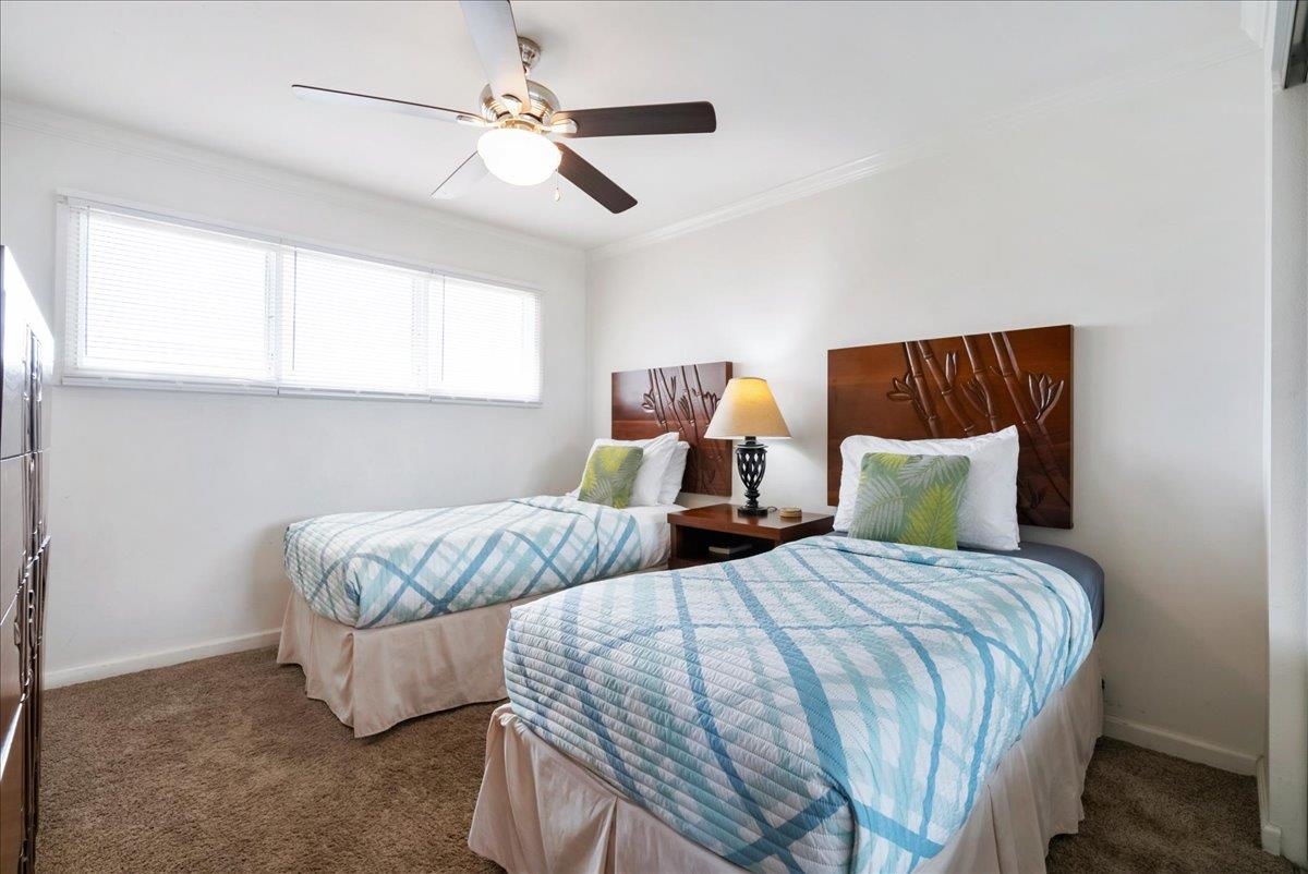 2430 South Kihei Road, Unit 206 Kihei, HI 96753 - Photo 24 of 40 a bedroom with two beds and ceiling fan