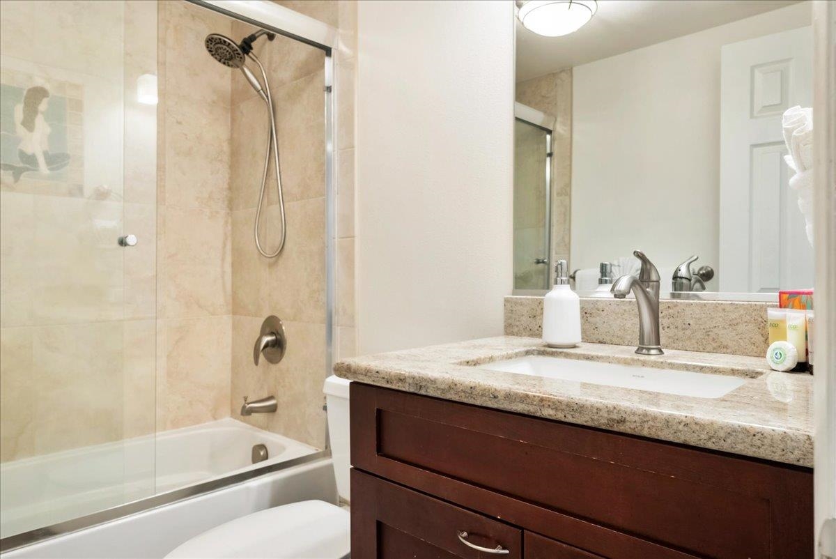 2430 South Kihei Road, Unit 206 Kihei, HI 96753 - Photo 26 of 40 a bathroom with a granite countertop sink toilet and shower