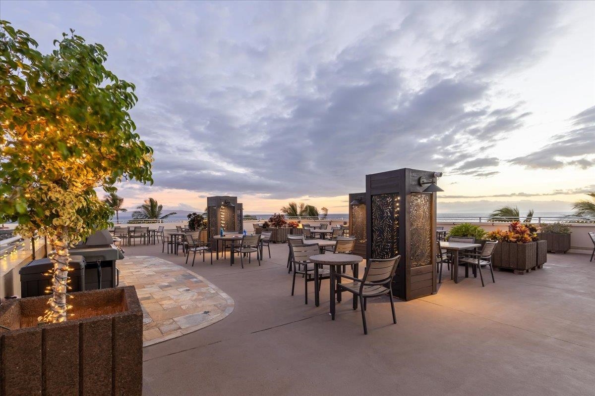 2430 South Kihei Road, Unit 206 Kihei, HI 96753 - Photo 28 of 40 a view of a patio with dining table and chairs