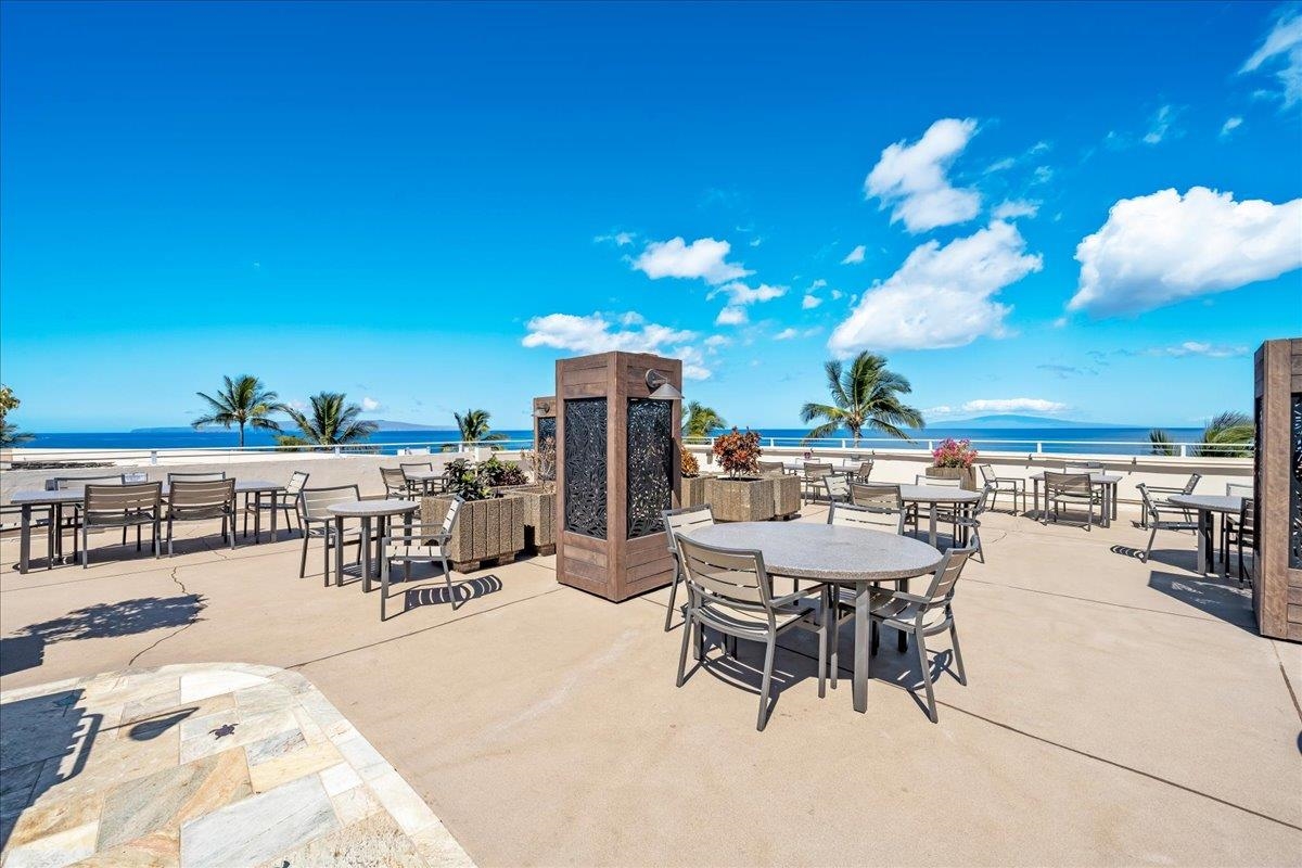 2430 South Kihei Road, Unit 206 Kihei, HI 96753 - Photo 33 of 40 a view of a chairs and tables in the patio