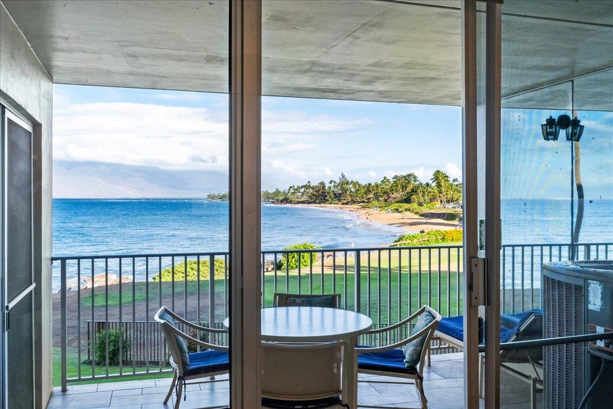 2430 South Kihei Road, Unit 206 Kihei, HI 96753 - Photo 5 of 40 a view of a chair and table in the balcony