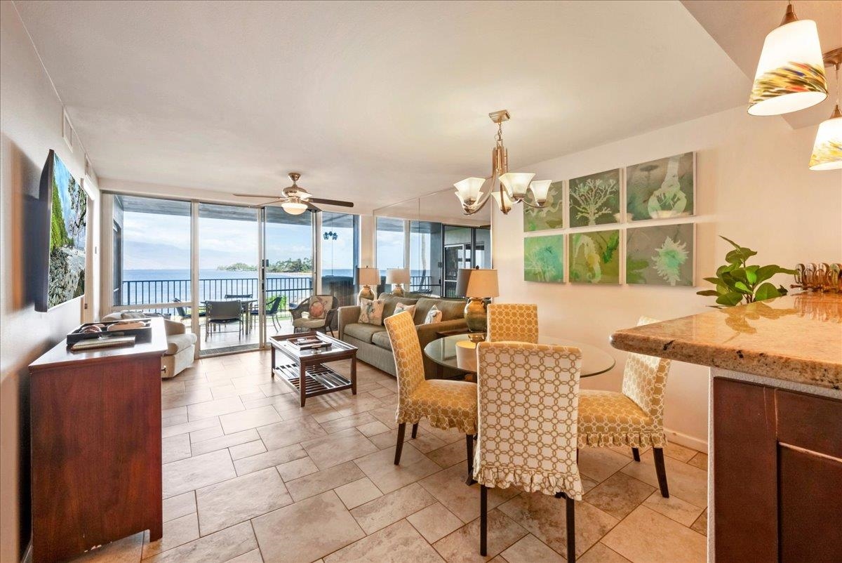 2430 South Kihei Road, Unit 206 Kihei, HI 96753 - Photo 10 of 40 a living room with fireplace furniture and a large window