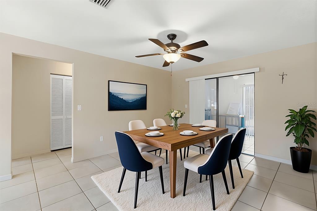 1437 Rommel Street Port Charlotte, FL 33952 - Photo 14 of 47 a dining room with furniture and window