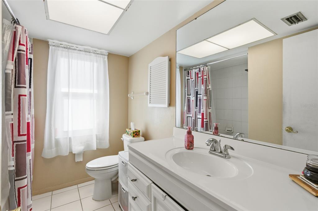 1437 Rommel Street Port Charlotte, FL 33952 - Photo 27 of 47 a bathroom with a sink toilet vanity and shower