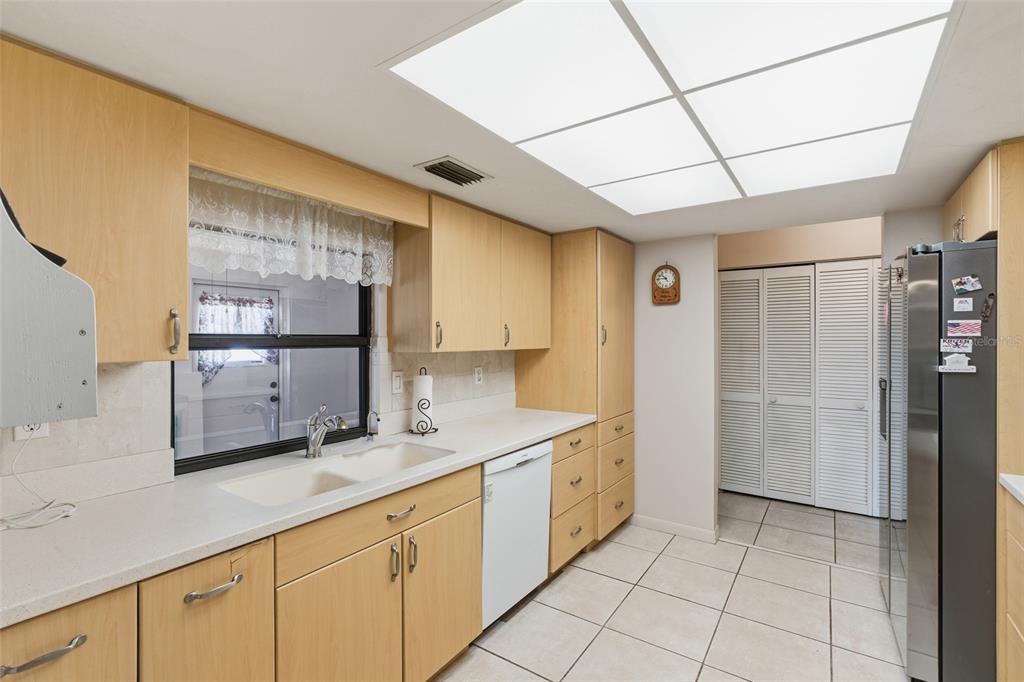 1437 Rommel Street Port Charlotte, FL 33952 - Photo 3 of 47 a kitchen with stainless steel appliances granite countertop a refrigerator and a sink