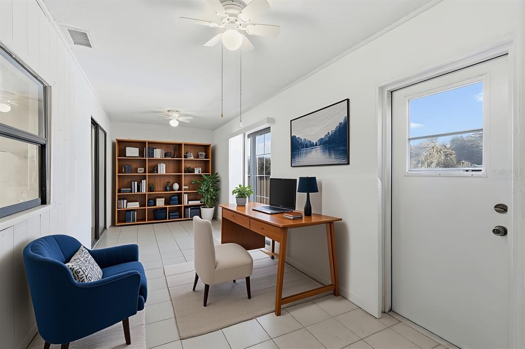 1437 Rommel Street Port Charlotte, FL 33952 - Photo 33 of 47 a livingroom with workspace and a couch