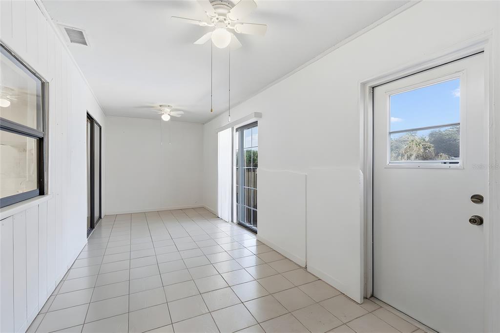 1437 Rommel Street Port Charlotte, FL 33952 - Photo 34 of 47 an empty room with fan and windows