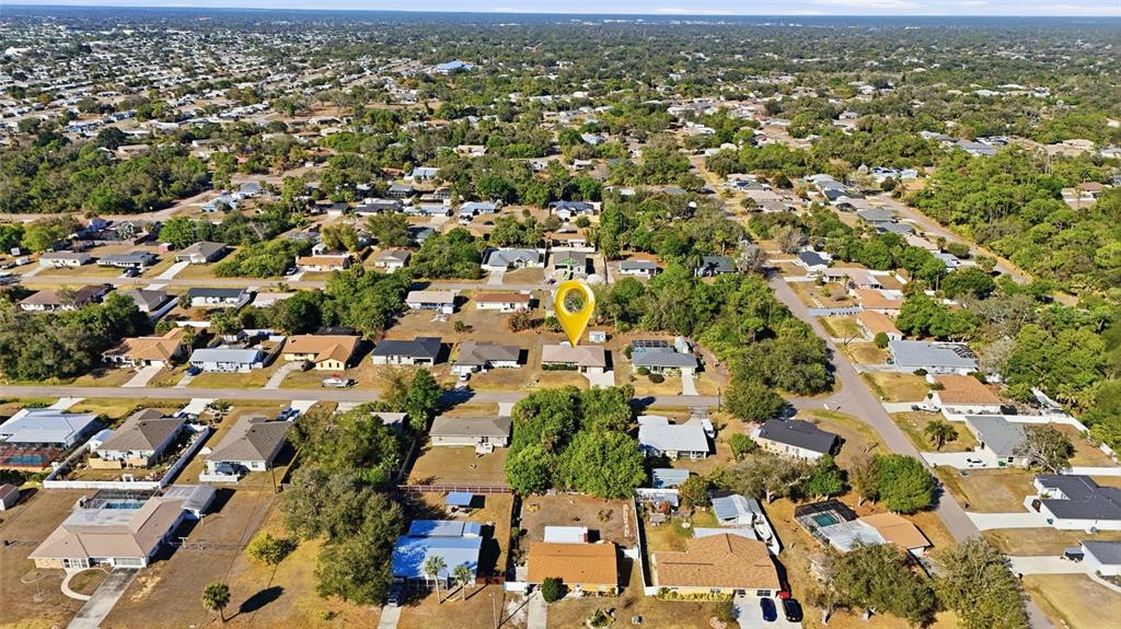 1437 Rommel Street Port Charlotte, FL 33952 - Photo 37 of 47 an aerial view of residential houses with outdoor space