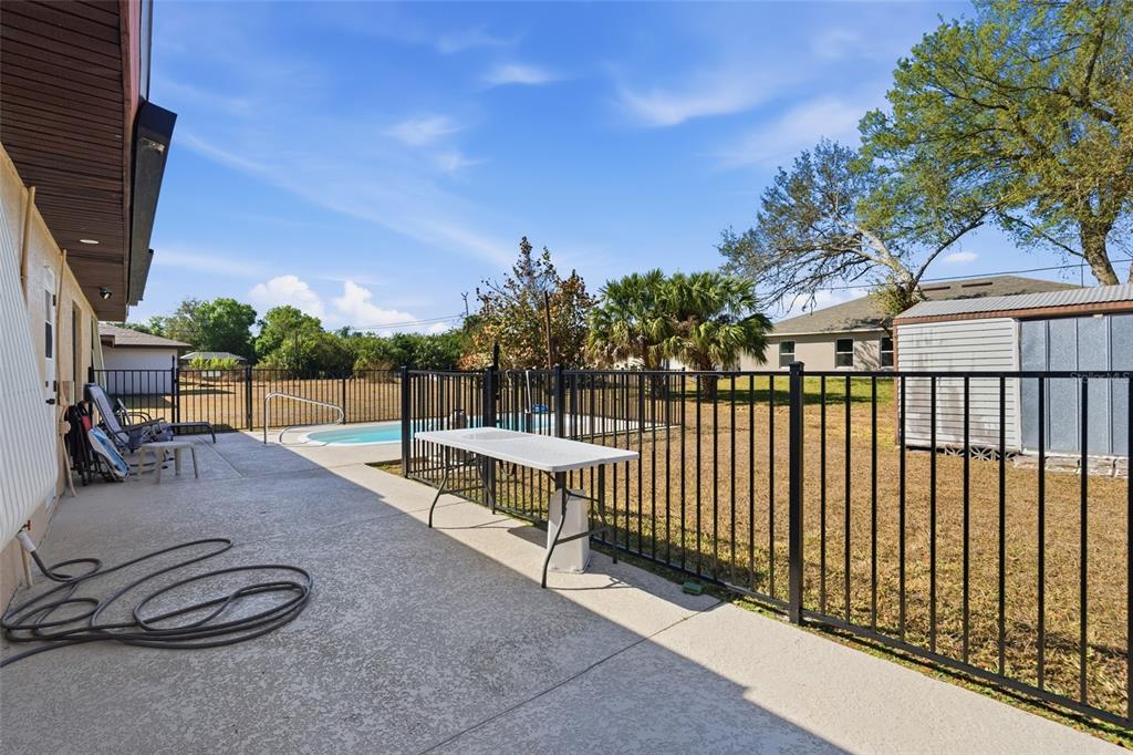 1437 Rommel Street Port Charlotte, FL 33952 - Photo 40 of 47 a view of a backyard with sitting area