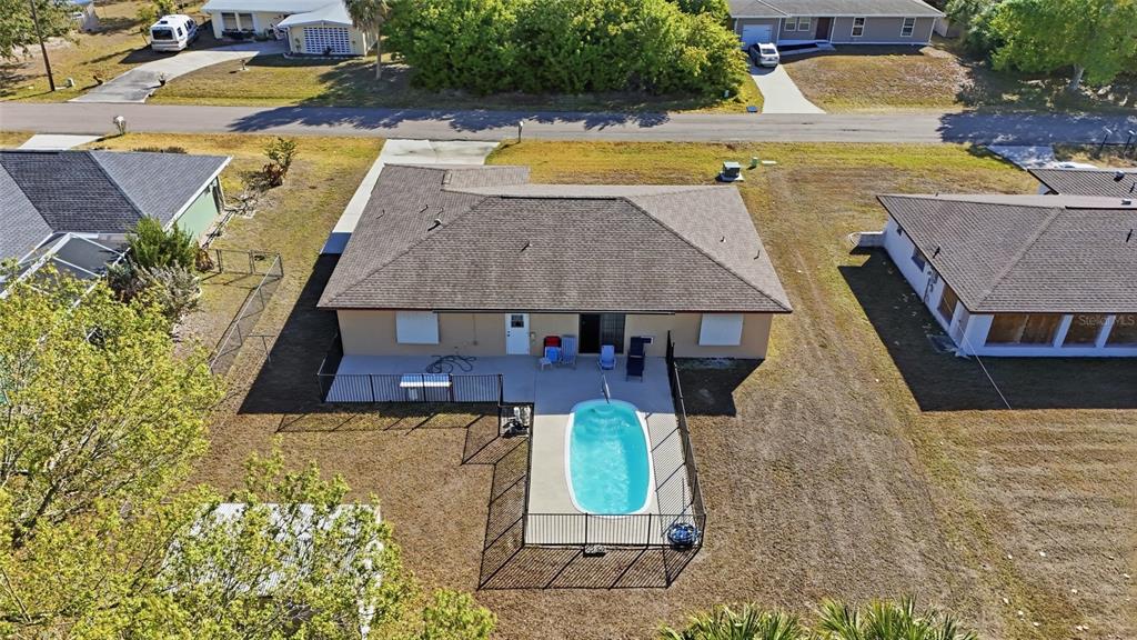 1437 Rommel Street Port Charlotte, FL 33952 - Photo 47 of 47 an aerial view of a house with swimming pool