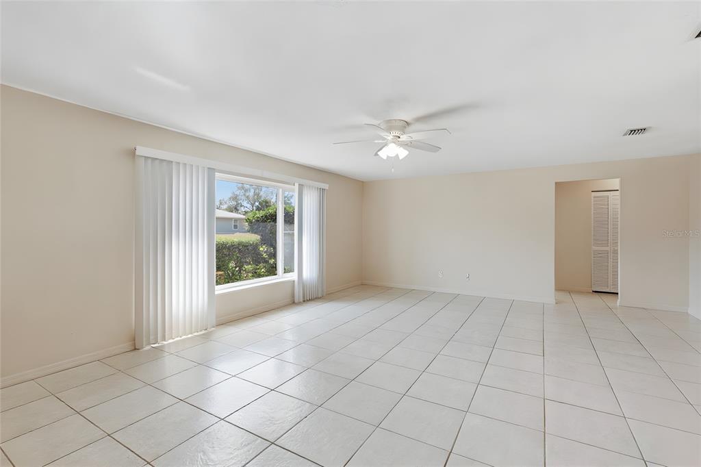 1437 Rommel Street Port Charlotte, FL 33952 - Photo 7 of 47 a view of an empty room with a window