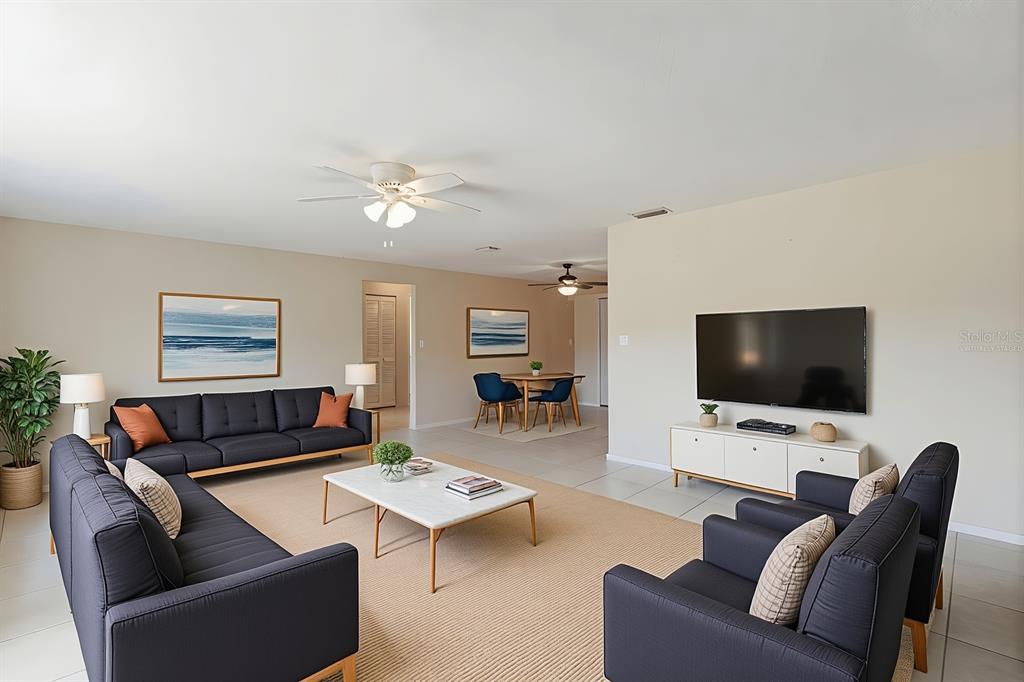 1437 Rommel Street Port Charlotte, FL 33952 - Photo 8 of 47 a living room with furniture and a flat screen tv