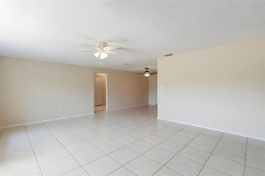 1437 Rommel Street Port Charlotte, FL 33952 - Photo 9 of 47 an empty room with closet and a ceiling fan