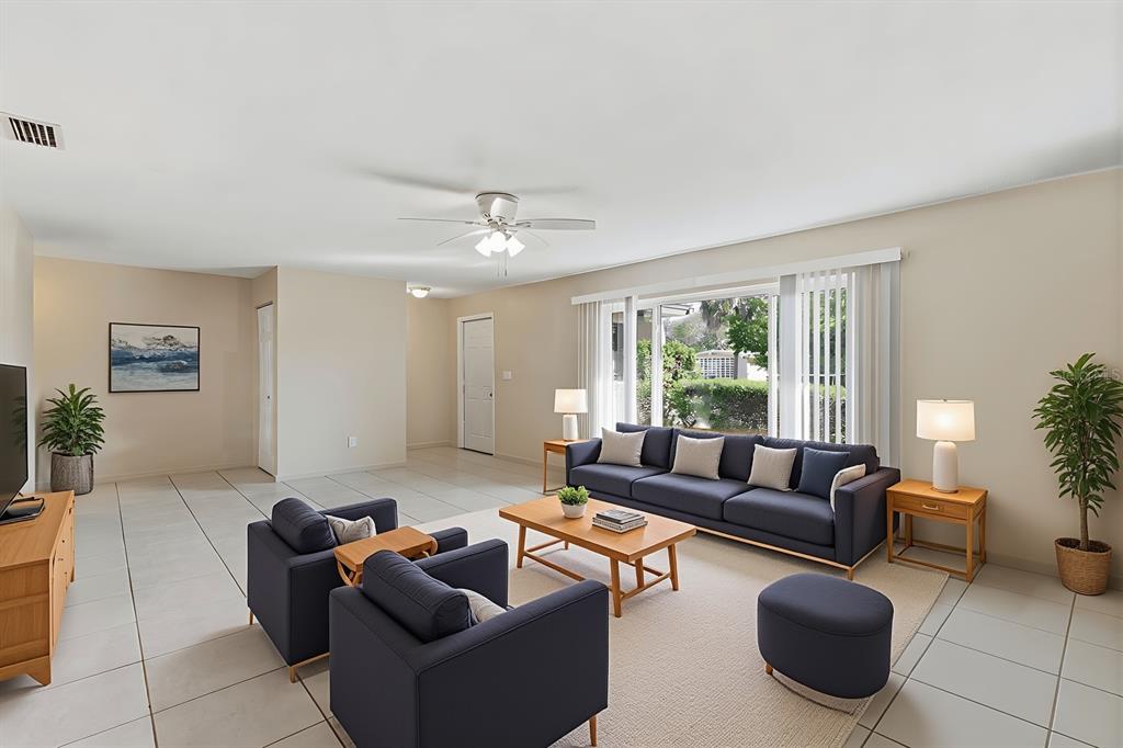 1437 Rommel Street Port Charlotte, FL 33952 - Photo 10 of 47 a living room with furniture and a large window