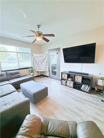 a living room with furniture and a large window