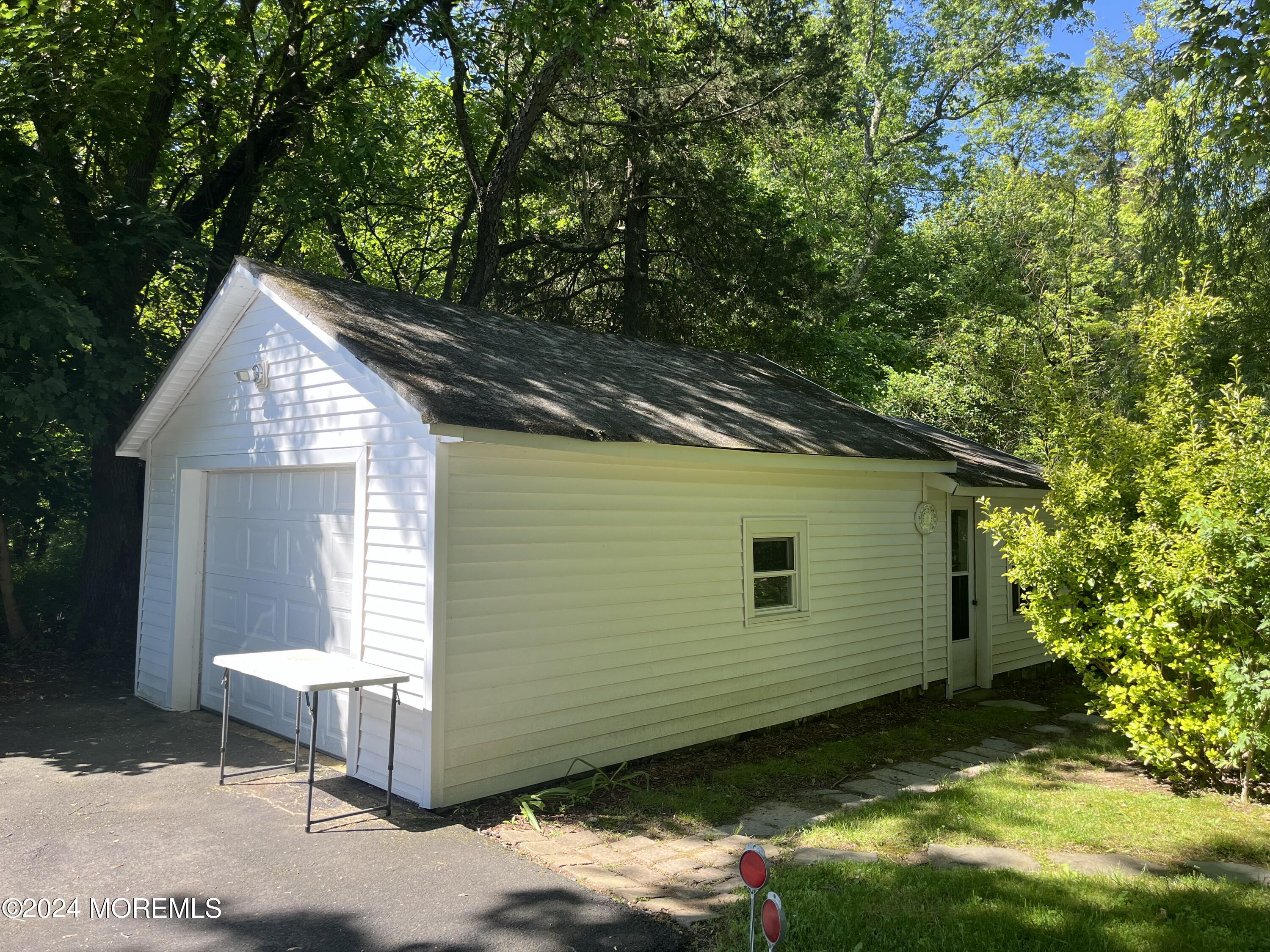 23 Robbins Road North Millstone Township, NJ 08535 - Photo 7 of 12 a view of backyard with a patio and a garden