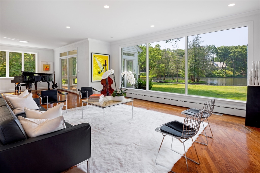 45 Cliff Road Weston, MA 02493 - Photo 8 of 26 a living room with furniture and a floor to ceiling window