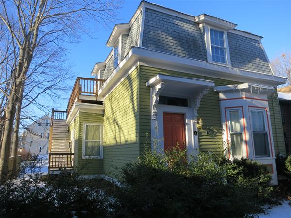 a view of a house with a flower garden