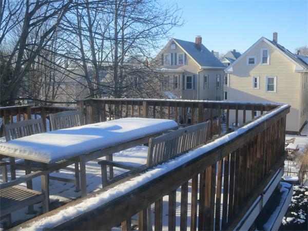 1 Rice Circle Cambridge, MA 02140 - Photo 14 of 18 a view of a wooden deck and a backyard with furniture