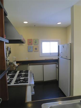 1 Rice Circle Cambridge, MA 02140 - Photo 7 of 18 a kitchen with a stove and a refrigerator