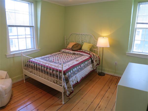 1 Rice Circle Cambridge, MA 02140 - Photo 10 of 18 a bed sitting in a bedroom next to a window