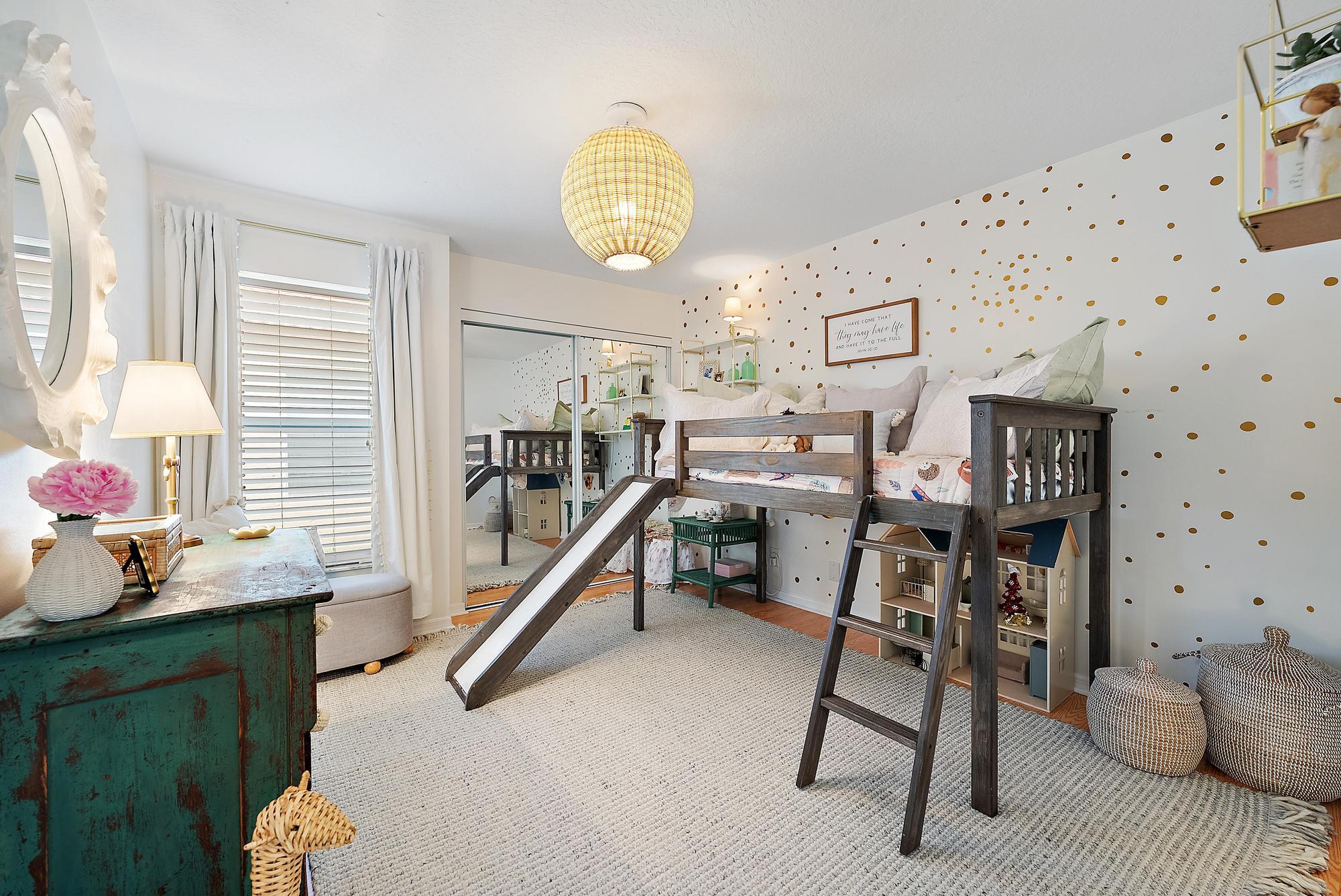 5010 Elpine Way Riviera Beach, FL 33418 - Photo 15 of 27 a bedroom with furniture and a wooden floor