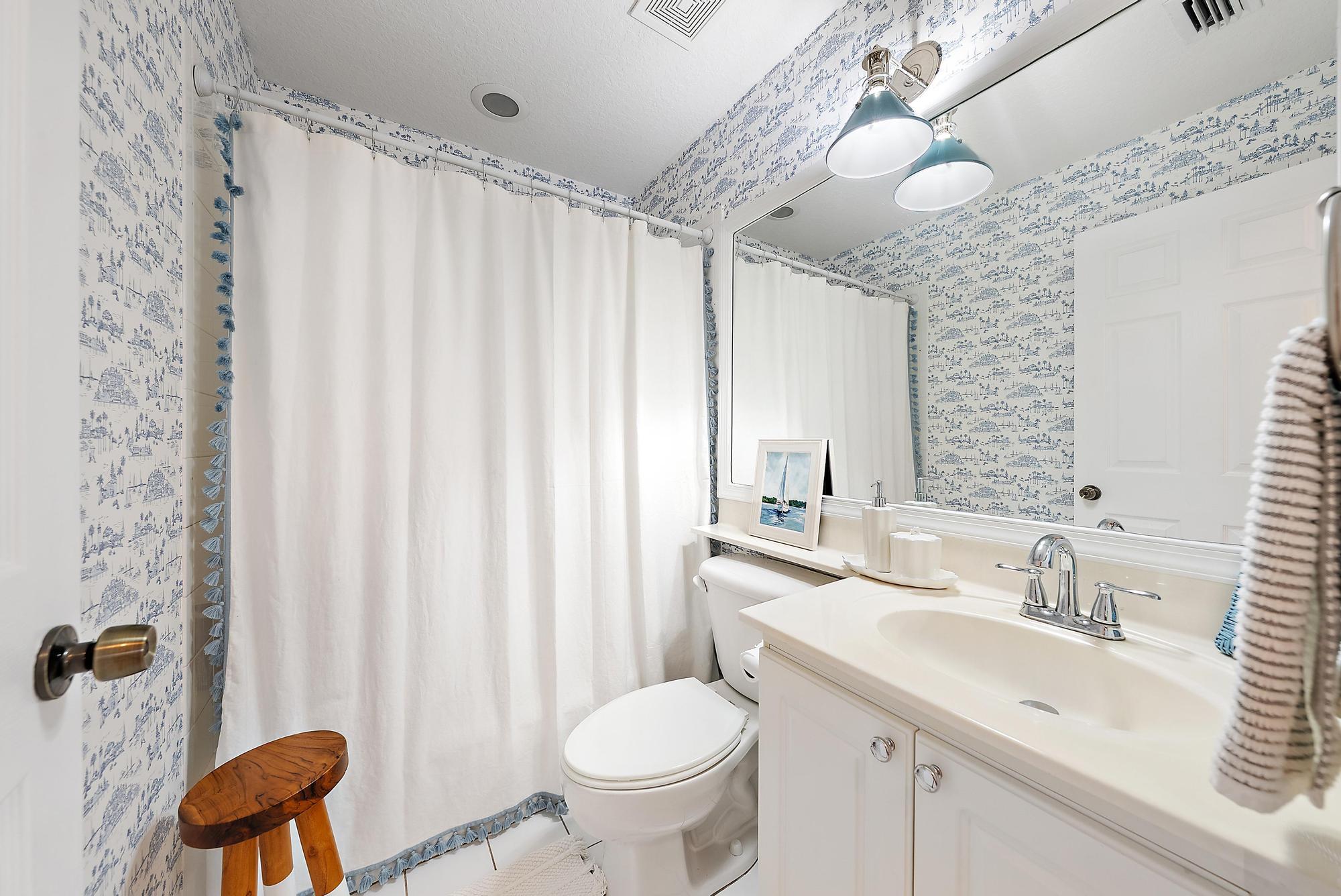 5010 Elpine Way Riviera Beach, FL 33418 - Photo 17 of 27 a bathroom with a sink toilet and shower